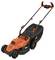 Electric lawnmower in black and orange, pictured from the side, with a foldable handle and large grass collection box.