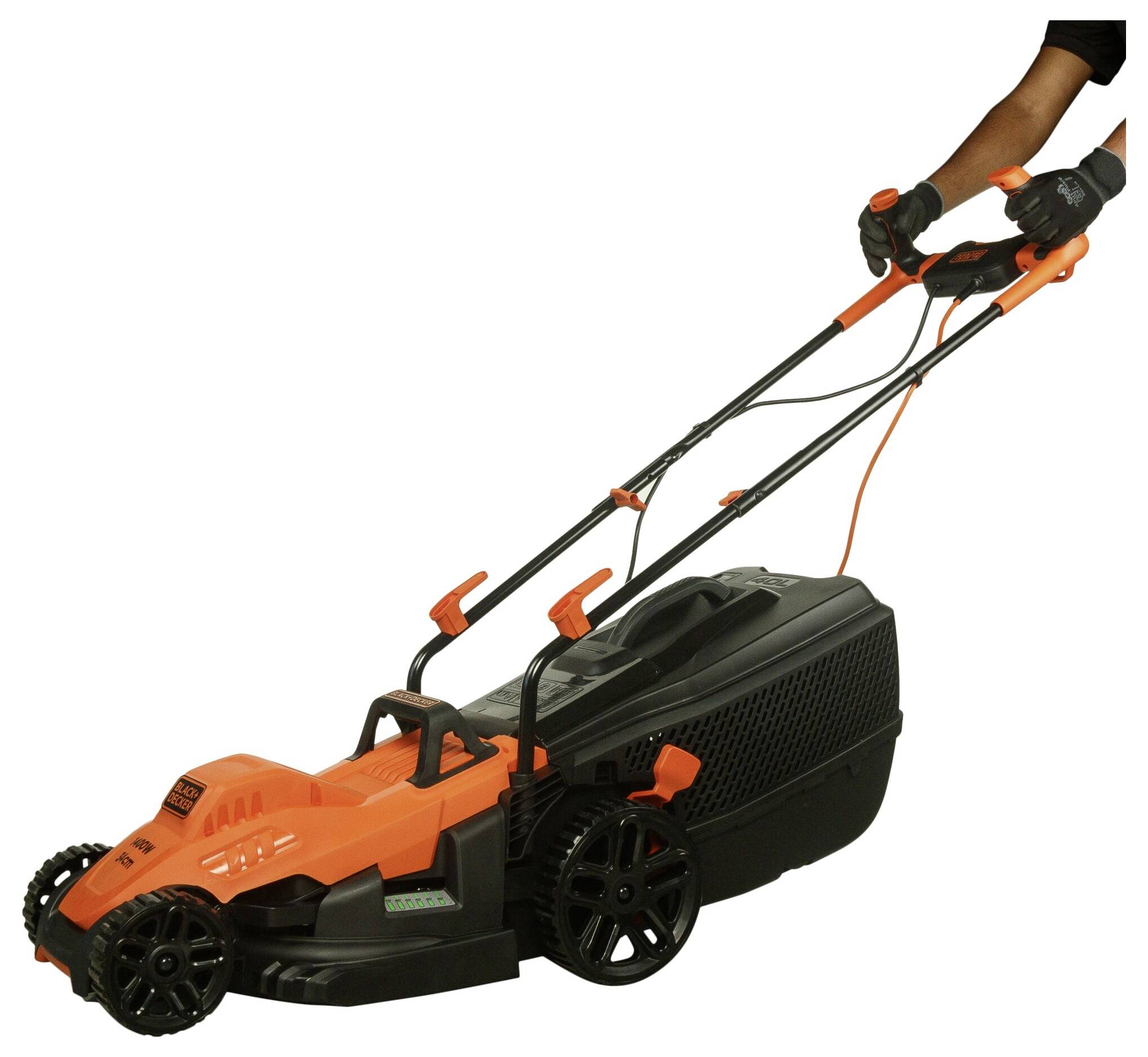 A person is pushing an orange-black electric lawn mower with a cable, which is visible on a lawn.