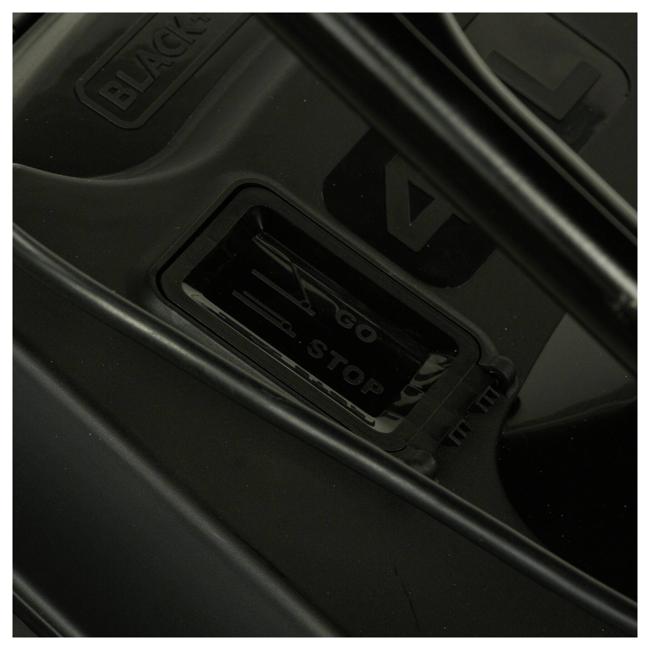 A black electronic button with the options 'GO' and 'STOP' is visible, indicated by black and white arrows.