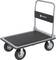 A flatbed trolley with a black surface, four wheels, and a metal handle, suitable for transporting heavy items.