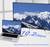 A laptop is connected to a large monitor displaying snowy mountains. Text reads '10.2 Gbps'. The setup highlights fast data transmission.