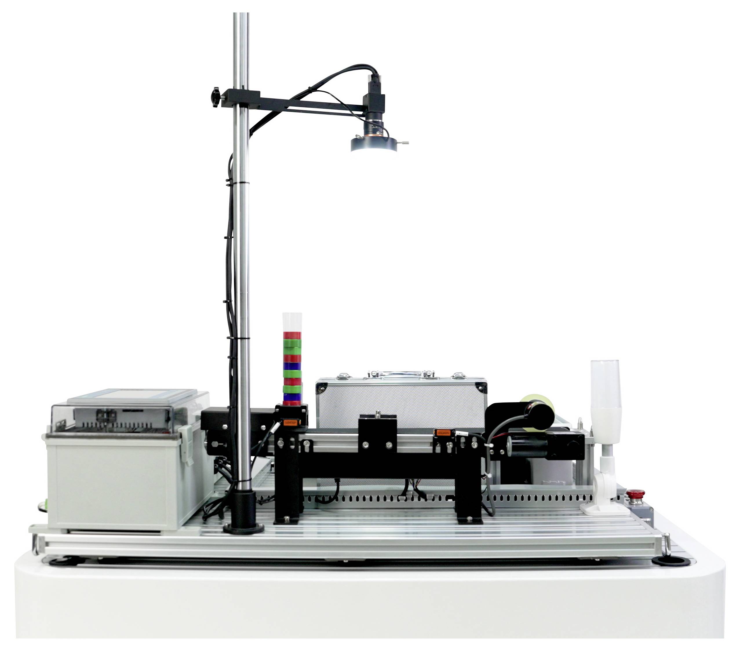 A robotic assembly line machine equipped with electronic components, a light fixture, and a stack of colored signal indicators.