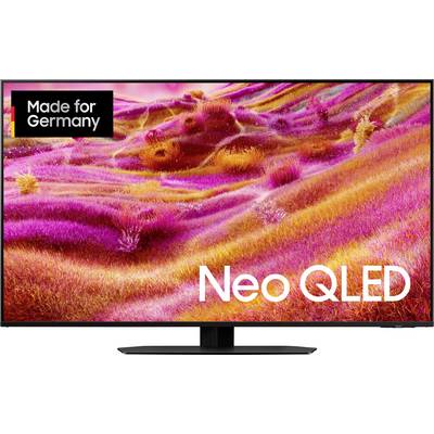Flat screen TV with the inscription 'Neo QLED', above it colorful, abstract art in pink and orange tones. In the top left the logo 'Made for Germany'.