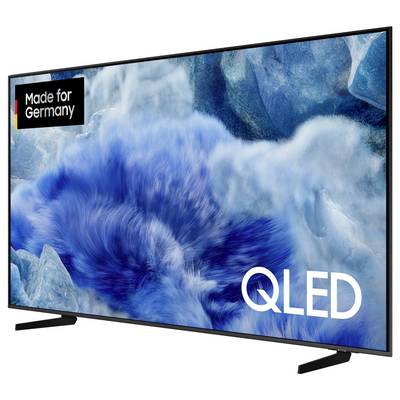 Flat screen television with blue, abstract background. Print: 'Made for Germany', 'QLED'. Modern design, large screen.