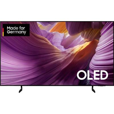 OLED television with a colorful picture showing curved, purple and orange rock formations. Logo in the upper left: Made for Germany.