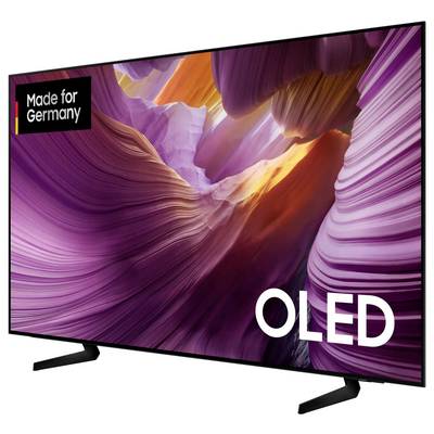 An OLED television with vibrant colors and the inscription 'Made for Germany'. The image shows a dramatic landscape of light and shadow.