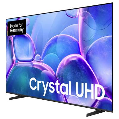 A large flat-screen television with the inscription 'Crystal UHD'. Colorful bubble graphics are visible on the screen. In the upper left it says 'Made for Germany'.