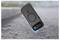 A smartphone in a protective case is shown falling onto a rough concrete surface, highlighting the case's durability and impact protection.