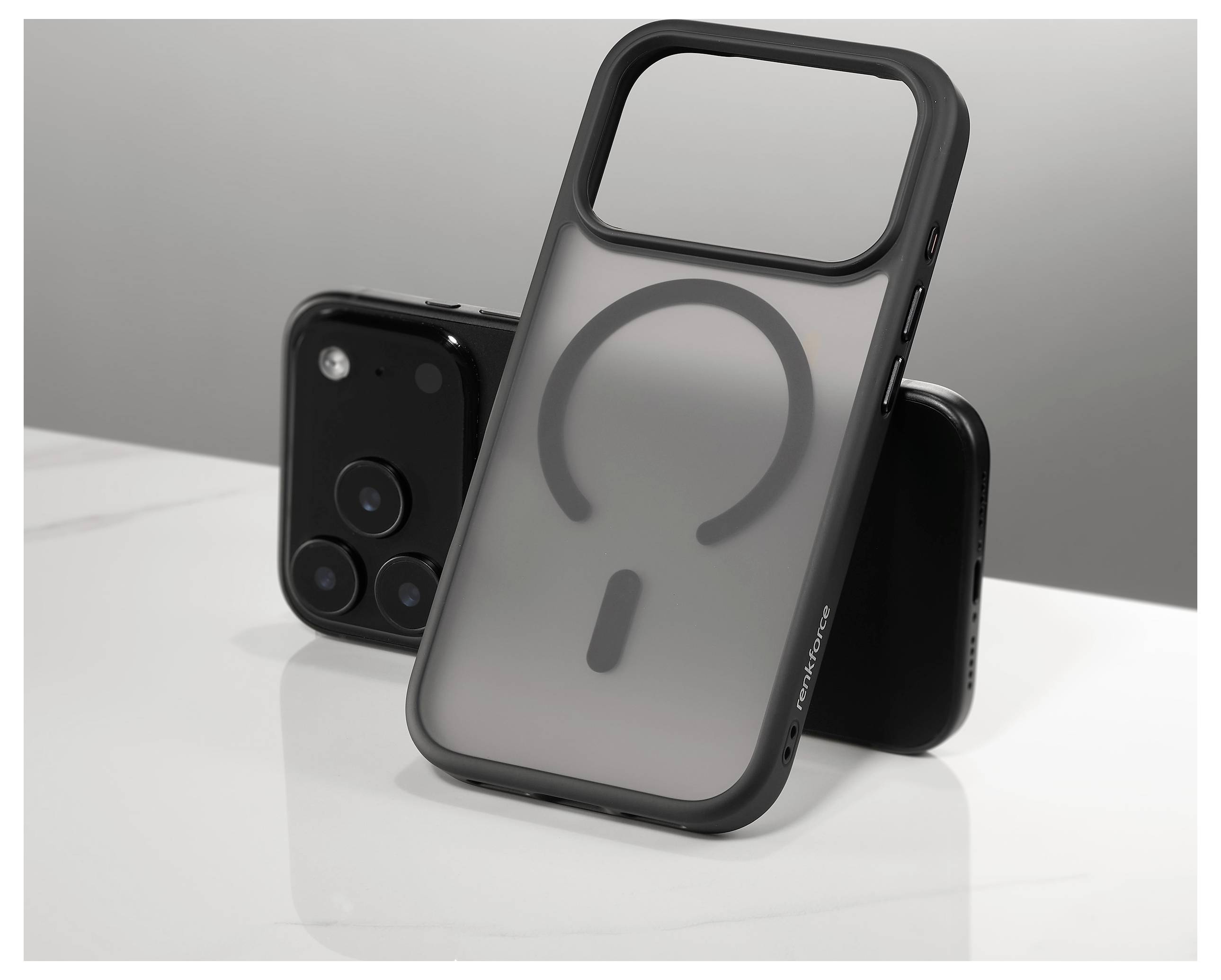 A black smartphone with dual cameras is partially covered by a transparent phone case standing upright, highlighting its MagSafe feature.