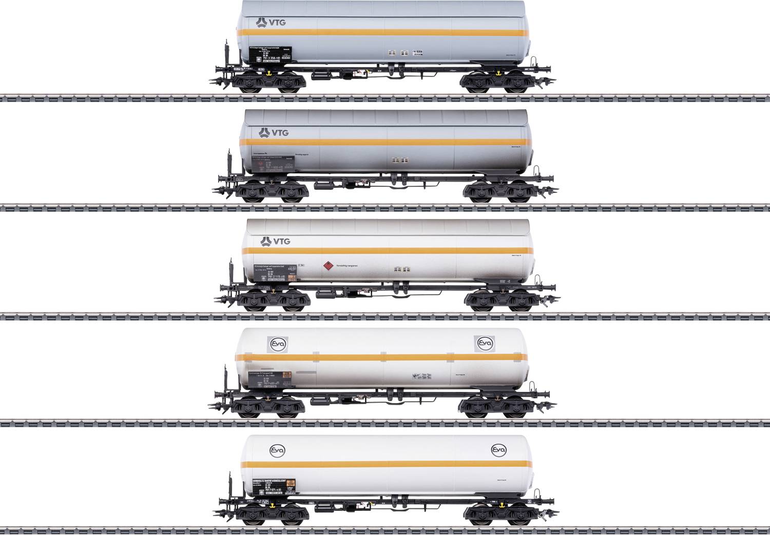 Five goods wagons in a row on railway tracks, each with a different logo and inscription visible from top to bottom.