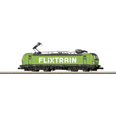 A green Flixtrain train with locomotive on the track, side view.