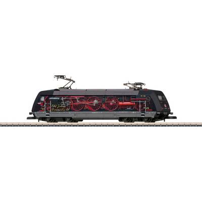 A black locomotive with red wheels and an inscription '100 Years of Standard Locomotive 01', pictured on railway tracks.