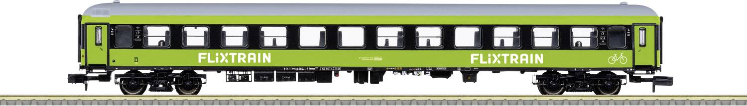 A green Flixtrain passenger carriage is standing on the track. On the carriage is written 'FLXTRAIN'.