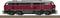 A red locomotive of the BR 217 class stands on a railway track. It is pictured from the side, showing details such as wheels and windows.