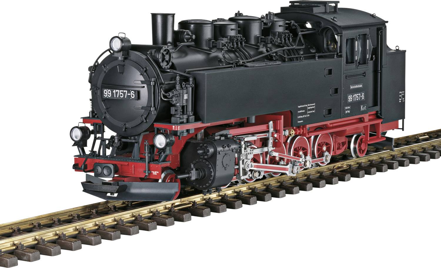 A black steam locomotive with a red chassis is travelling on a track. It has a classic design with visible boilers and pipes.