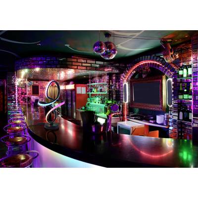 A vibrant nightclub with colorful neon lights, a glossy bar with high stools, a large mirror, and shelves stocked with bottles in a lively setting.