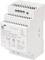 A white enclosed electronic power supply module, labeled 'POWER SUPPLY' with specifications including input and output voltage and current.