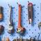 'Happy Dads Wrench Set' on display board with various tools, including wrenches, utility knife, and screwdrivers, mounted on a blue pegboard.