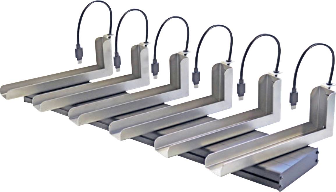 Six parallel arranged metallic angles, each with a connected black cable. They lie on a flat black base.