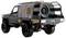 A robust grey off-road vehicle with armored rear section and spare tire, suitable for rough terrain.