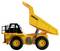 Yellow, remote-controlled toy dump truck with black chassis and tiltable loading bed, side view.