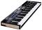 A MIDI keyboard controller with 49 keys, rotary knobs and pads for music production, black with wood accent on the side.