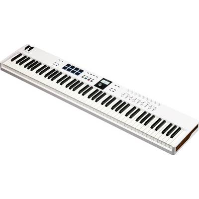 A white MIDI keyboard with 61 keys, various controls, pads and a small display, suitable for music production.