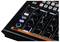 A gray audio mixing console with multiple controls and buttons, including knobs for volume, tone, and effects.
