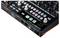 A music controller with multiple knobs and switches, labeled 'BEATSTEP PRO' and 'ARTURIA', for controlling music software.