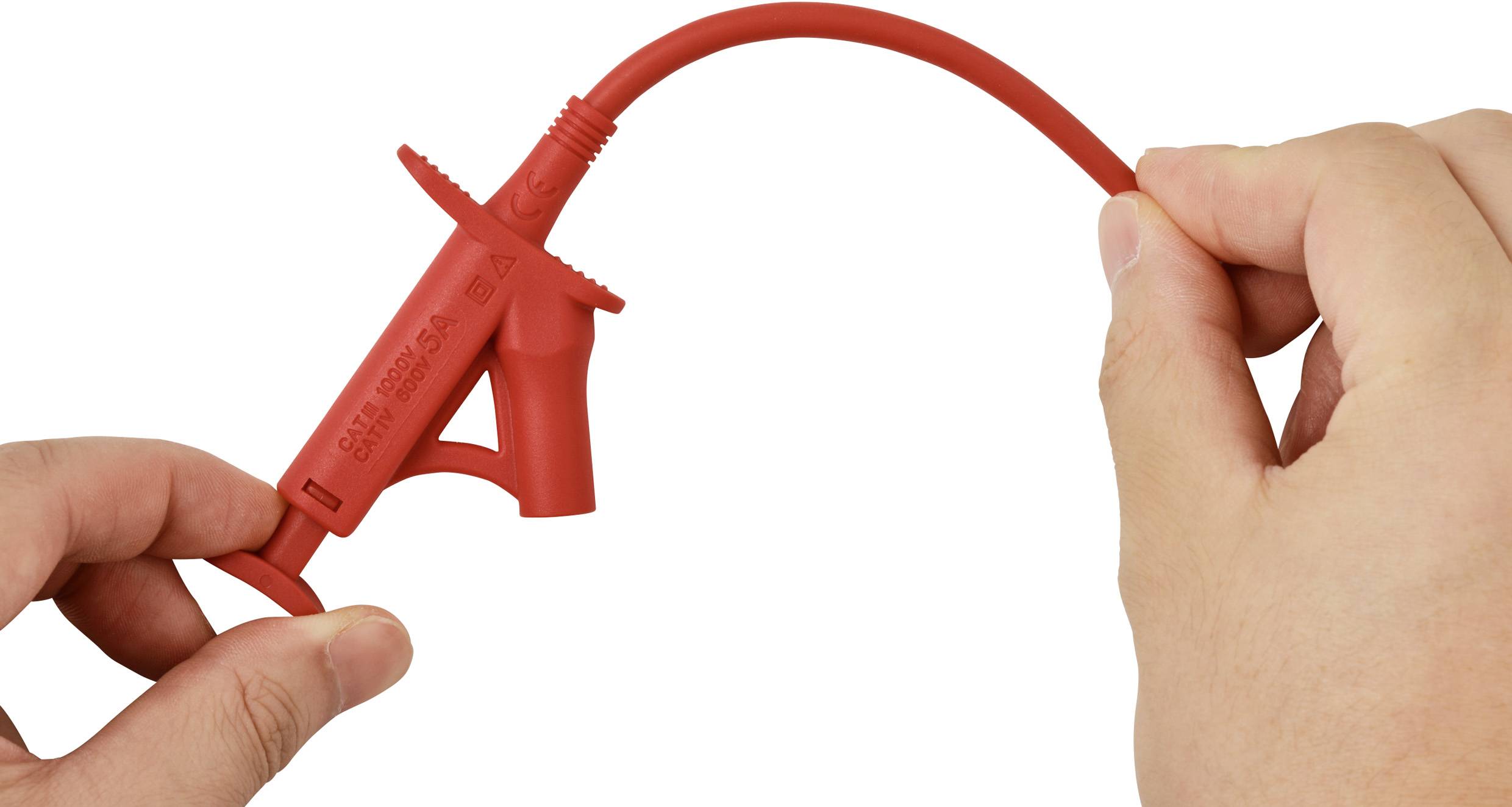 Person holding red insulated electrical clip and wire, demonstrating flexibility.