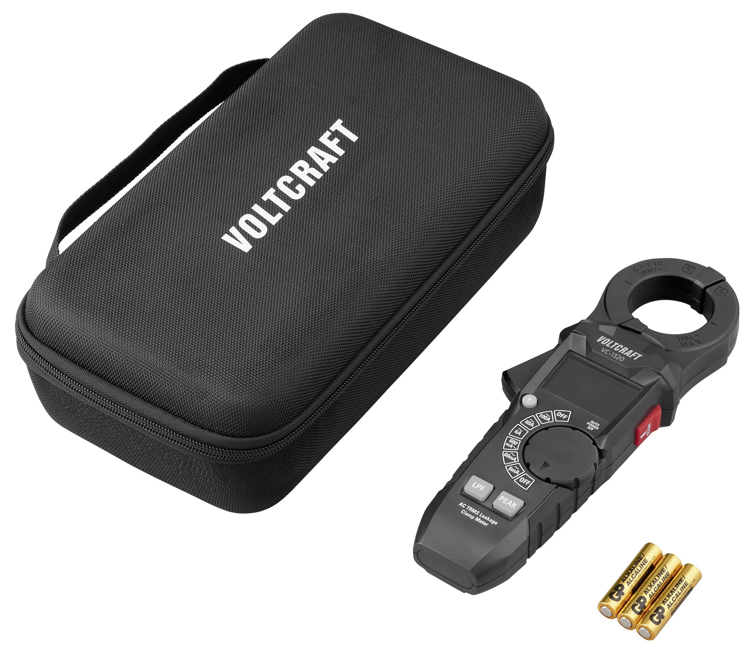 A digital clamp meter with a carrying case labeled 'VOLTCRAFT' alongside three AA batteries. The meter has various function buttons.