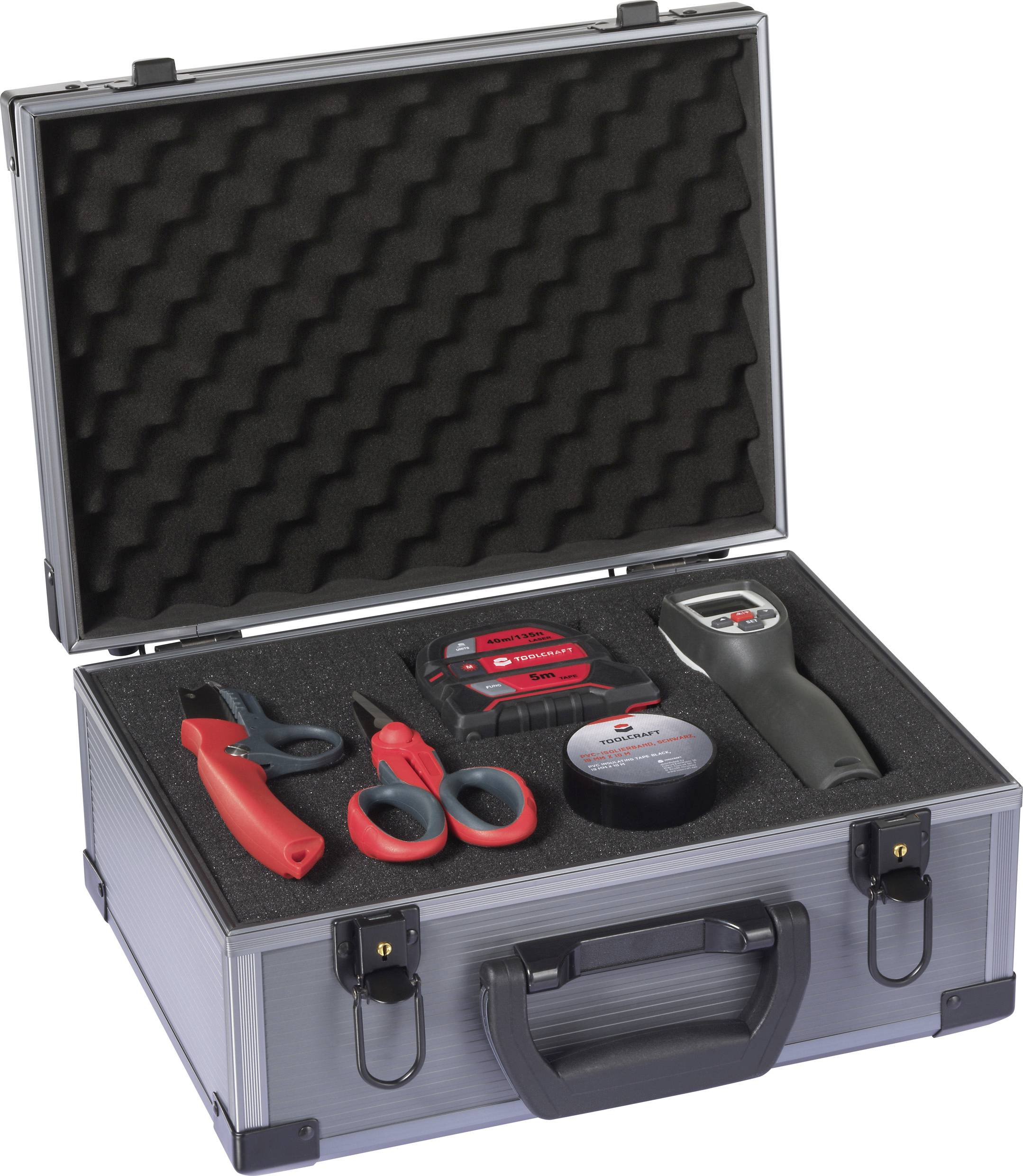 Silver tool case containing a variety of electrical tools, including a cutter, scissors, measuring tape, and a voltage tester.