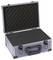 Open silver briefcase with black foam padding inside, designed for protecting fragile items during transportation.