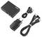 A black digital audio converter with input and output ports, accompanied by a USB power cable, HDMI cable, and a power adapter.