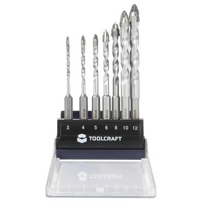 A set of eight metal drill bits of various sizes, labeled from 3mm to 12mm, displayed in a tool holder branded 'Toolcraft'.