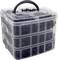 A transparent, three-tiered plastic storage box with a black handle, filled with assorted dark-colored fasteners.