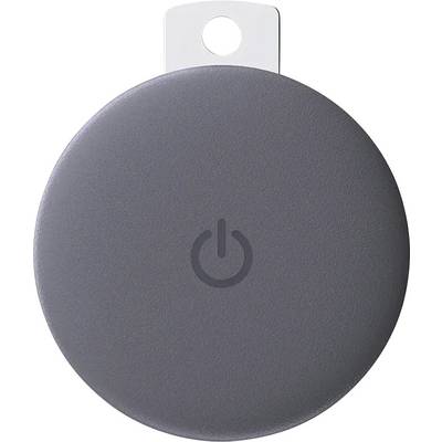 A circular, gray tracking device with a power symbol on one side, featuring a small white tag with a hole at the top for attaching.
