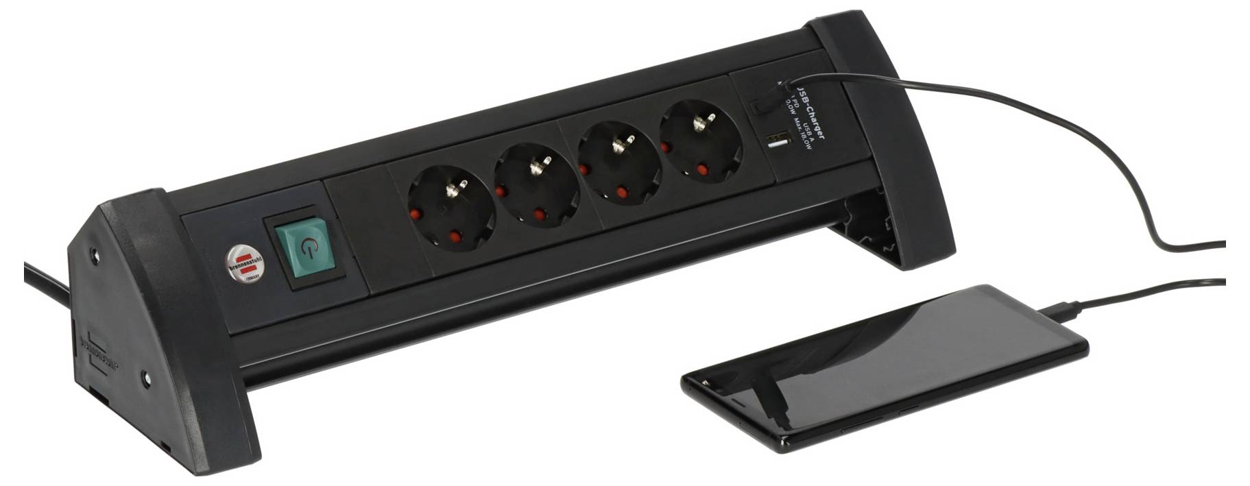 Black desktop power strip with four outlets, a power switch, and connected USB charging pad on the right.