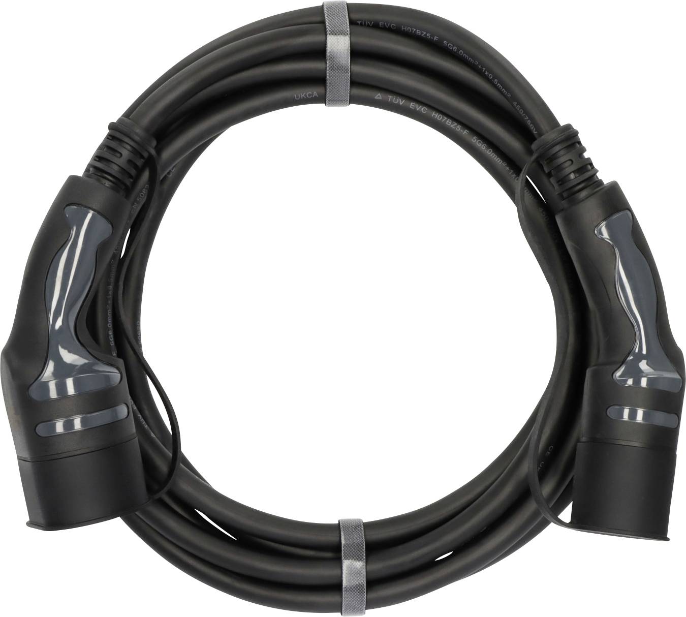 Coiled black electric vehicle charging cable with two connector plugs on a white background.