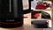 'Bosch kettle in modern design with black and red accents. Features include a water level indicator, ergonomic handle, and secure lid.'