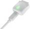 A white electronic charger with a glowing green symbol on the top, connected to a cable, indicating power flow or charging status.
