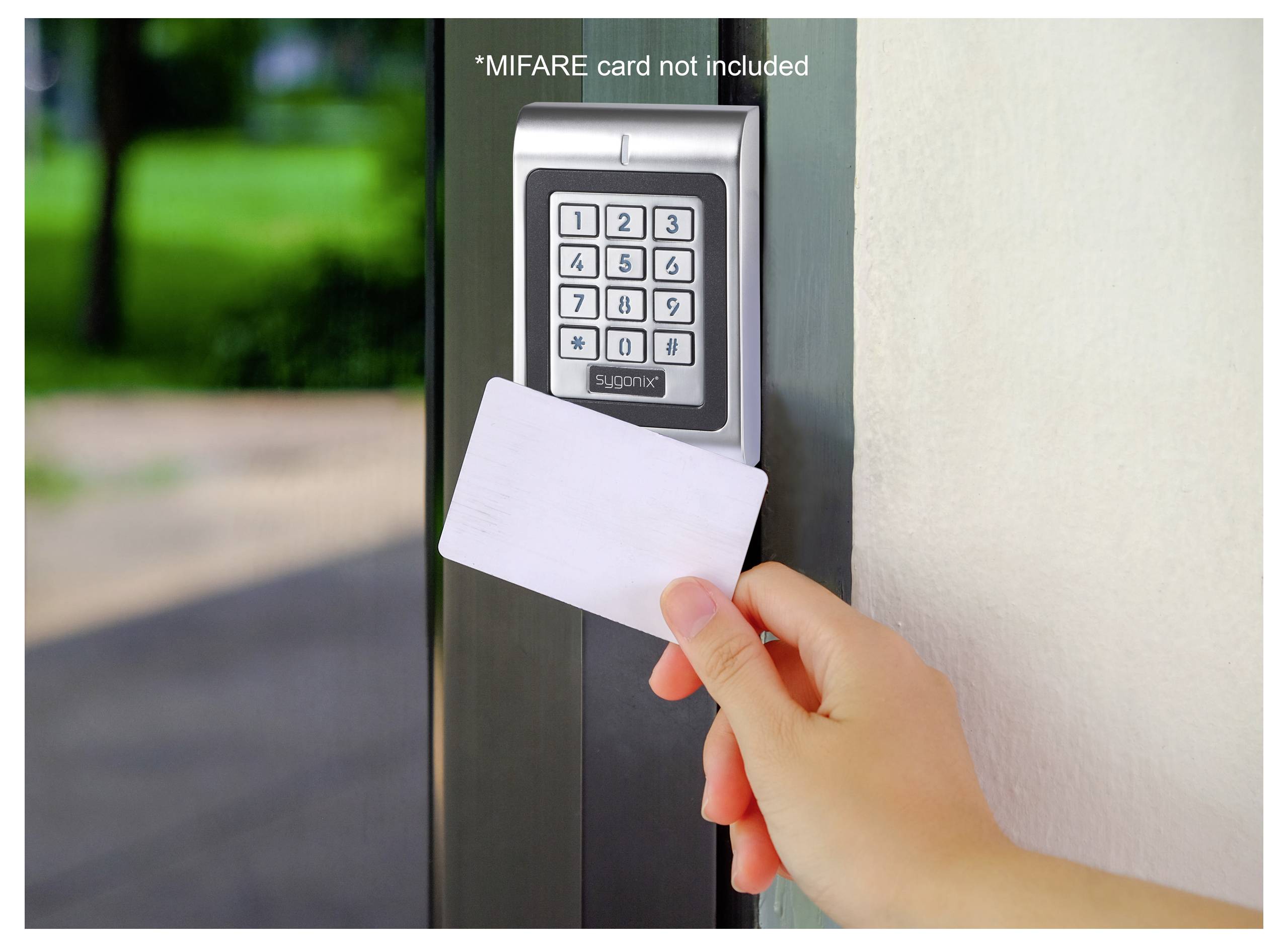 A hand holds a white card near a keypad on a door access control system. The text reads 'MIFARE card not included.'