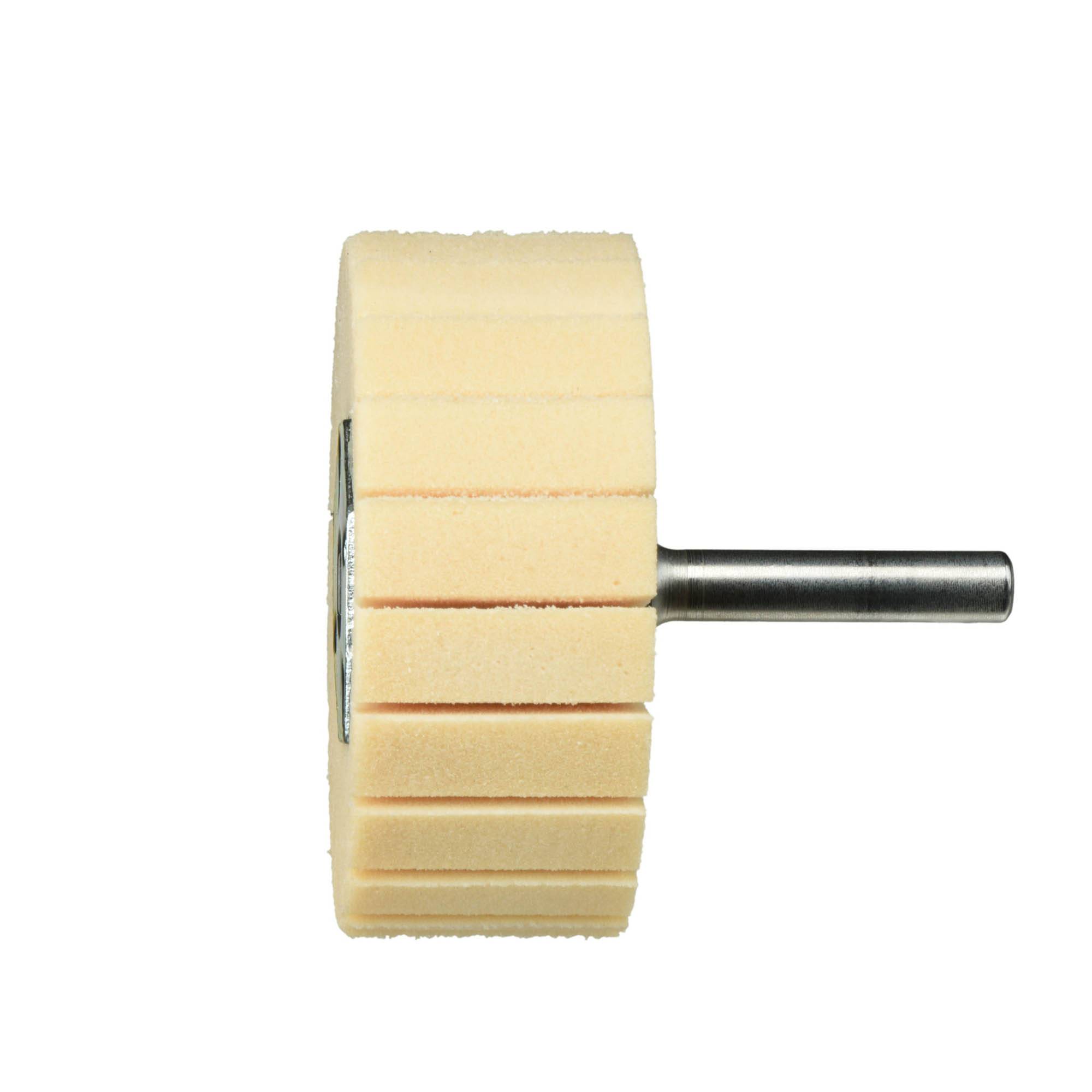 A cylindrical buffing wheel with grooved edges, attached to a metal shaft, viewed from the side against a white background.