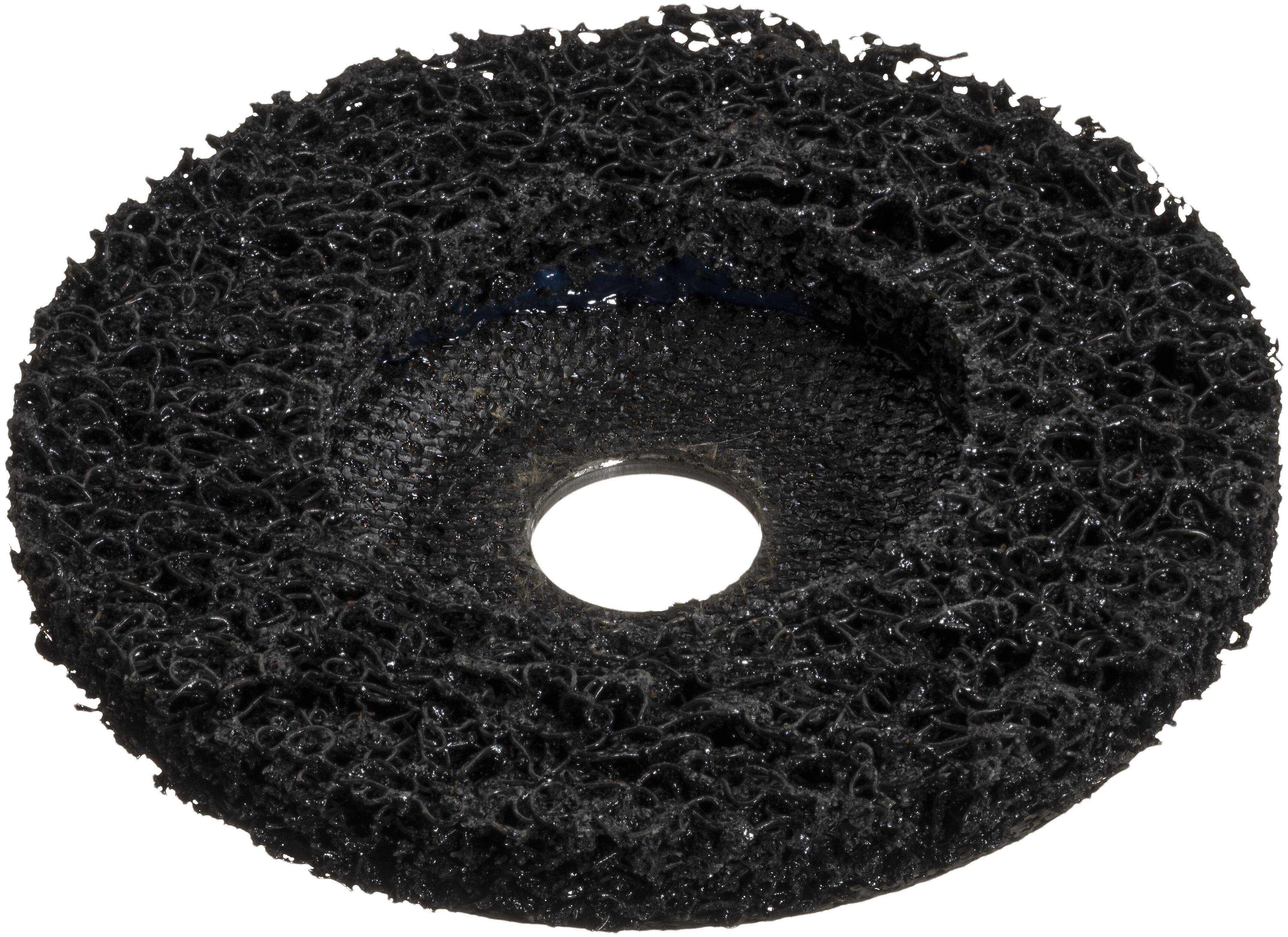 A black abrasive grinding disc with a textured, open-weave surface and a hole in the center, used for removing rust or paint.
