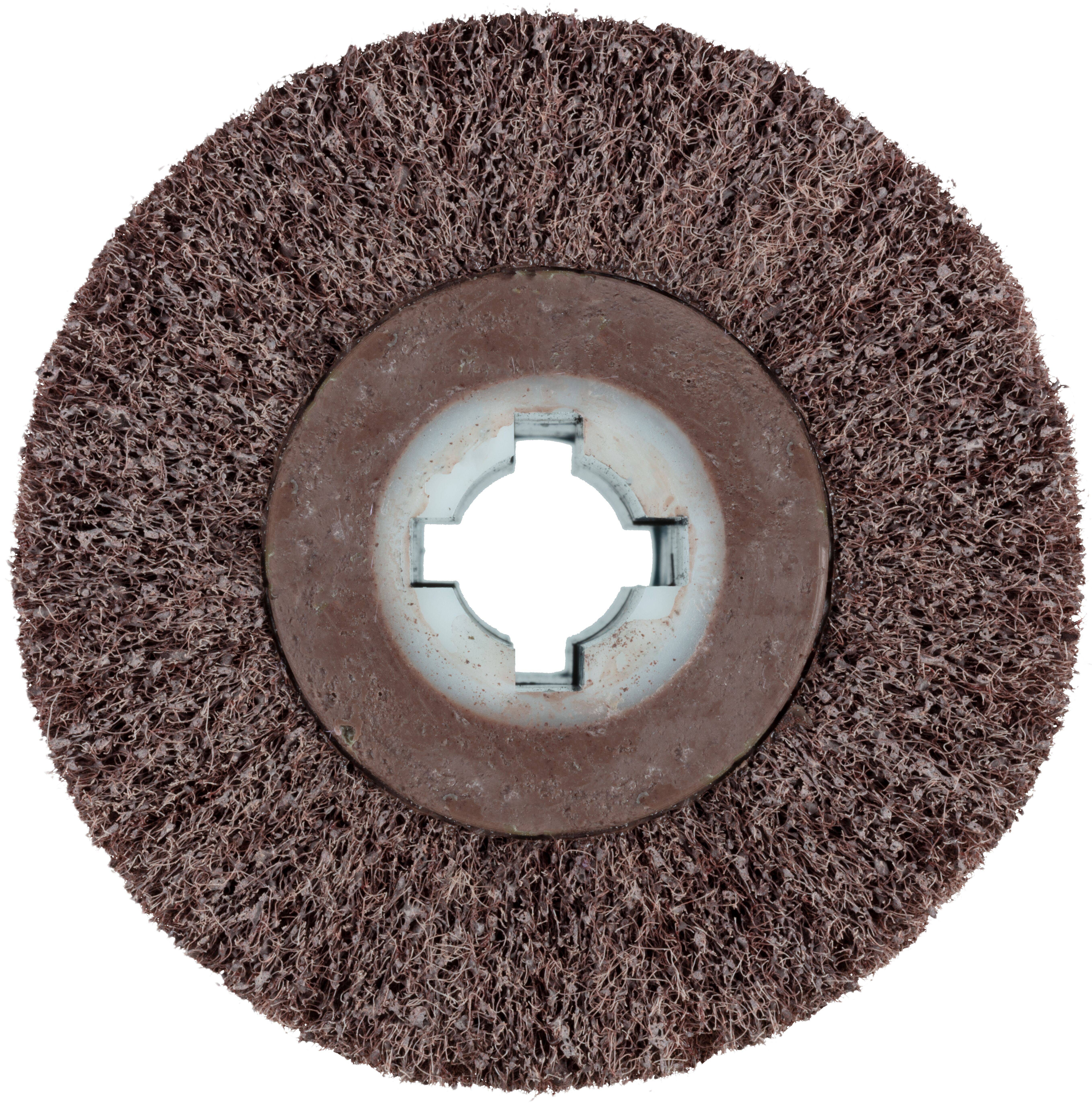 A round, coarse-textured abrasive disc with a central hole, used for sanding or grinding surfaces.
