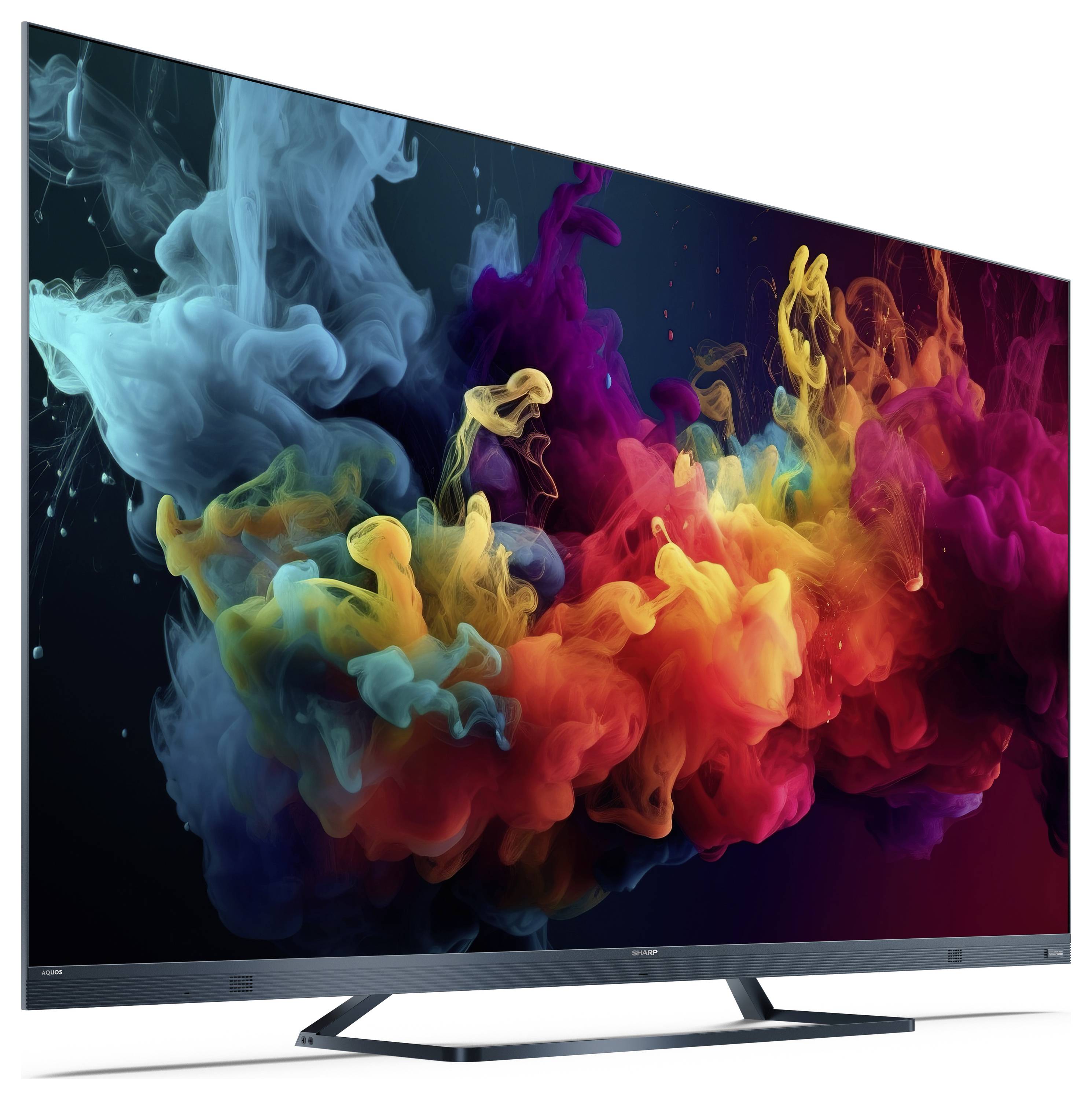 A modern flat-screen TV displaying vibrant, swirling colors in shades of blue, green, yellow, and red against a dark background.