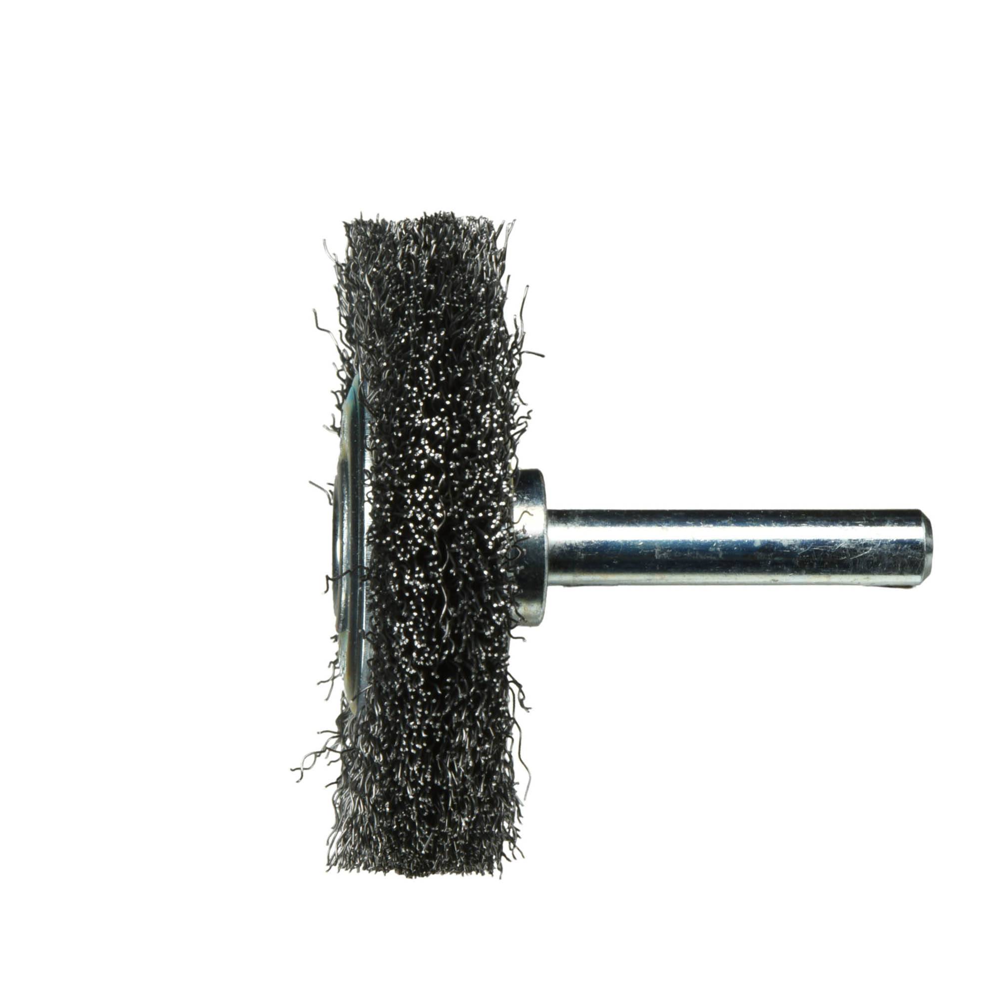 A wire brush wheel with a metal shank, used for cleaning or polishing. It has dense bristles and a cylindrical attachment point.