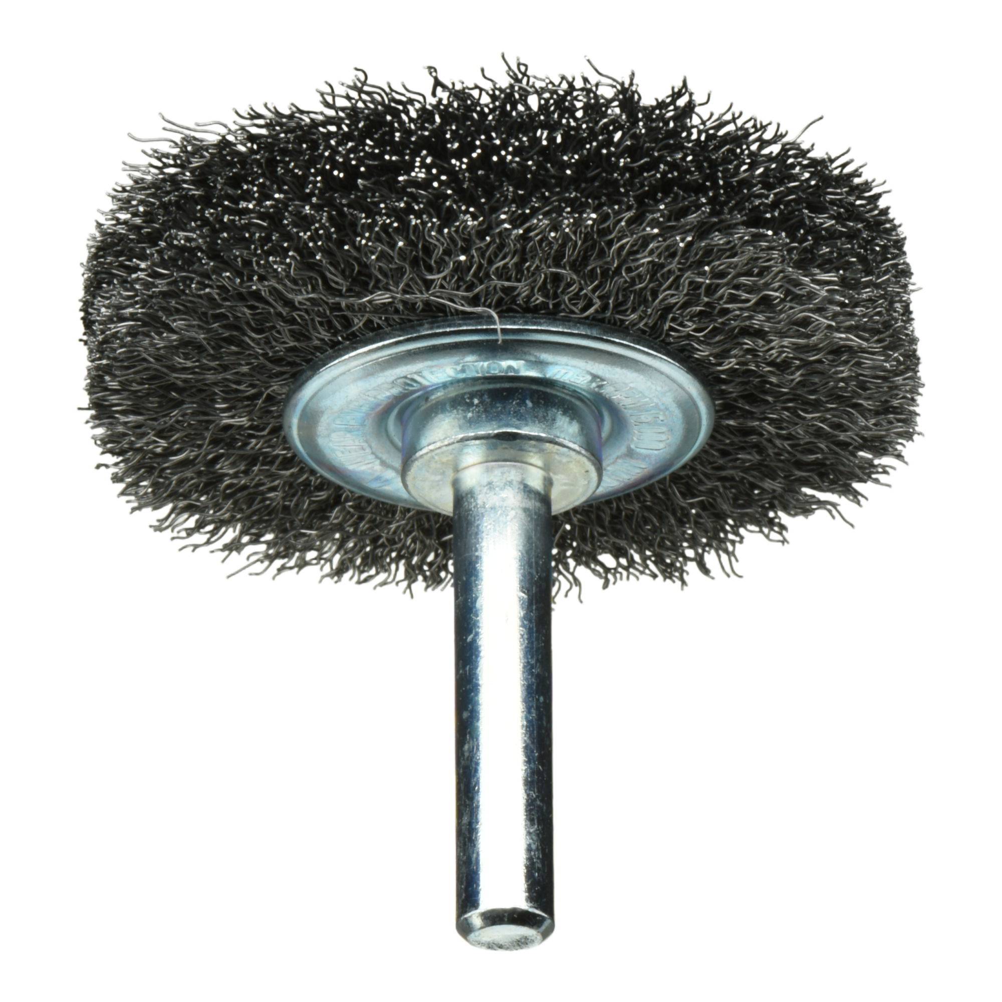 A wire wheel brush with a metal shank, used for cleaning, deburring, and surface finishing on metal objects.