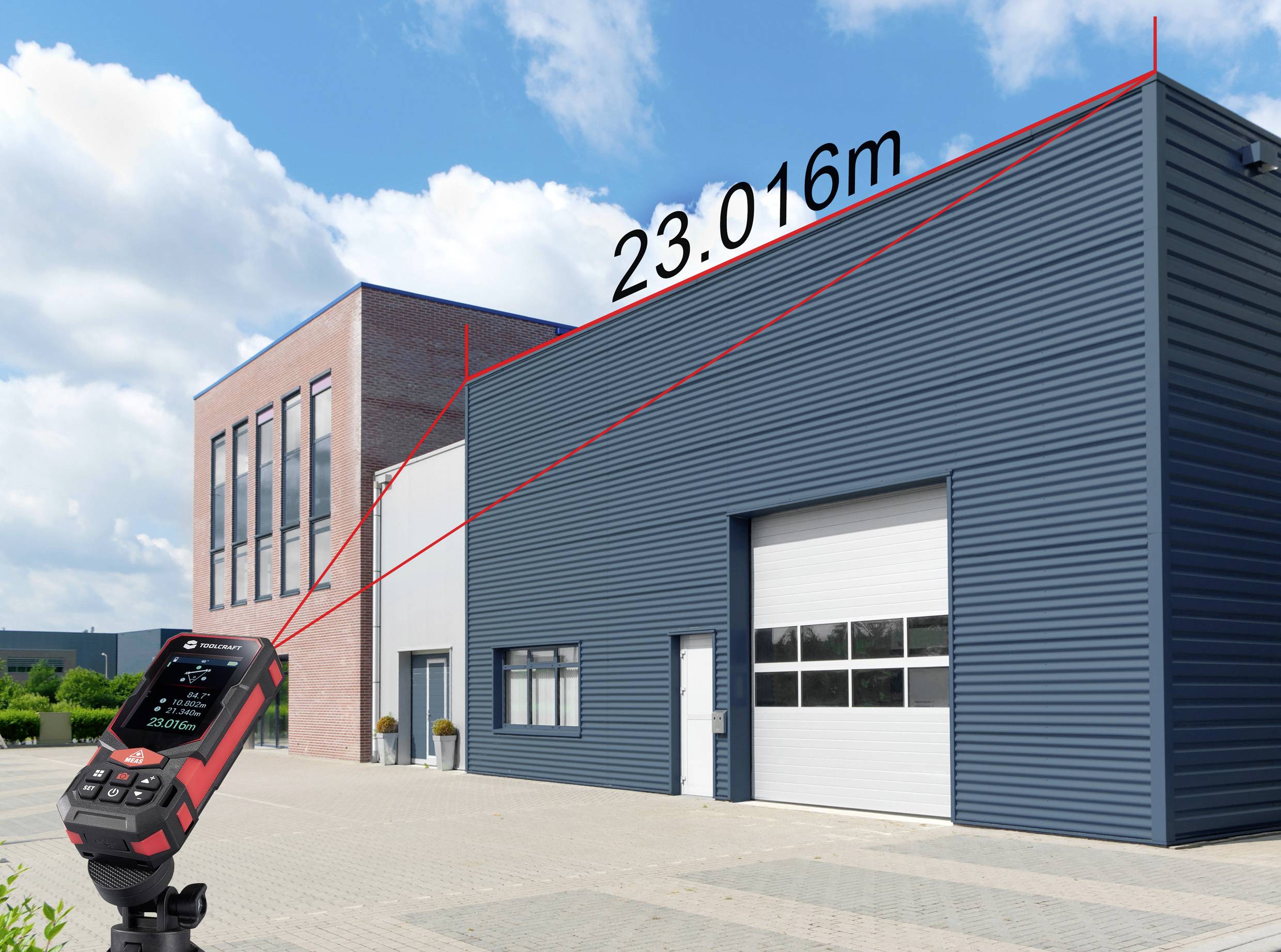 A device measures the distance to the top of a blue industrial building, displaying '23.016m'. Another brick building is adjacent.