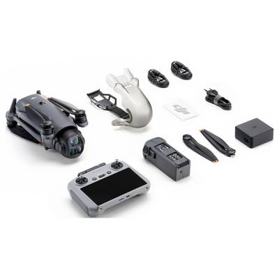 Drone kit with a folded drone, remote control, camera gimbal protector, battery, propellers, cables, charger, and a power adapter.